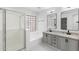Modern bathroom with a separate shower and tub, double sink vanity, and elegant fixtures at 10760 W Encanto Blvd, Avondale, AZ 85392