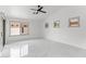 Bright bedroom with luxury marble floors, ceiling fan, and lots of natural light at 10760 W Encanto Blvd, Avondale, AZ 85392