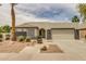 Inviting single-story home with desert landscaping and a convenient two-car garage at 10760 W Encanto Blvd, Avondale, AZ 85392