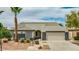 Charming single-story home with desert landscaping and a two-car garage at 10760 W Encanto Blvd, Avondale, AZ 85392