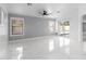 Elegant living room with marble floors and a view of the backyard pool and patio at 10760 W Encanto Blvd, Avondale, AZ 85392