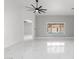 Spacious living room with marble floors, a ceiling fan, and bright windows with a pool view at 10760 W Encanto Blvd, Avondale, AZ 85392