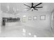 Open-concept living room with marble floors, plenty of natural light, and access to the kitchen at 10760 W Encanto Blvd, Avondale, AZ 85392