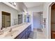 Modern bathroom featuring double sinks, updated fixtures and a large mirror at 11069 E Kilarea Ave # 194, Mesa, AZ 85209