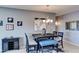 Dining area with a stylish table and chandelier at 11069 E Kilarea Ave # 194, Mesa, AZ 85209