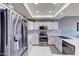Kitchen features stainless steel appliances and stylish white cabinets at 11069 E Kilarea Ave # 194, Mesa, AZ 85209