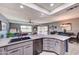 Open kitchen features a large island and stainless steel appliances at 11069 E Kilarea Ave # 194, Mesa, AZ 85209