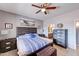 Spacious main bedroom with serene decor, wood furniture, and view of attached bathroom at 11069 E Kilarea Ave # 194, Mesa, AZ 85209