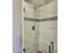 Contemporary shower with tile surround, and modern fixtures at 11069 E Kilarea Ave # 194, Mesa, AZ 85209