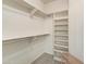 Spacious walk-in closet featuring ample shelving and hanging space for organization at 11069 E Kilarea Ave # 194, Mesa, AZ 85209