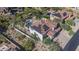 Aerial showing home's tile roof, solar panels, backyard pool, and landscaped desert setting at 11446 E Sweetwater Ave, Scottsdale, AZ 85259
