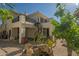 Charming backyard featuring a spiral staircase, balcony, and stucco exterior at 11446 E Sweetwater Ave, Scottsdale, AZ 85259