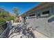 Back of house view from a covered balcony featuring a stucco exterior at 11446 E Sweetwater Ave, Scottsdale, AZ 85259