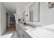 Bathroom features double sinks with marble countertops and updated fixtures at 11446 E Sweetwater Ave, Scottsdale, AZ 85259
