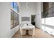 Stunning dining room with statement lighting and lots of natural light at 11446 E Sweetwater Ave, Scottsdale, AZ 85259