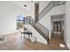 Open foyer with a modern staircase, high ceilings, and ample natural light at 11446 E Sweetwater Ave, Scottsdale, AZ 85259