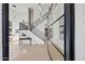 Modern foyer with open staircase, high ceilings, designer lighting, and clerestory windows at 11446 E Sweetwater Ave, Scottsdale, AZ 85259