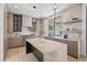 Gourmet kitchen with marble countertops, stainless steel appliances, and light and dark wood cabinetry at 11446 E Sweetwater Ave, Scottsdale, AZ 85259