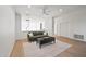 Living room with hardwood floors, modern decor and ceiling fan at 11446 E Sweetwater Ave, Scottsdale, AZ 85259