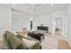 Living room featuring a sofa, coffee table, hardwood floors and ceiling fan at 11446 E Sweetwater Ave, Scottsdale, AZ 85259