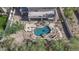 Aerial shot of a backyard pool featuring a unique shape, waterfall feature, and elegant landscaping at 11446 E Sweetwater Ave, Scottsdale, AZ 85259