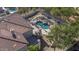 Aerial view showing backyard pool with tile roof and upper patio, set in landscaped desert environment at 11446 E Sweetwater Ave, Scottsdale, AZ 85259