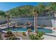 Backyard swimming pool featuring a rock waterfall and lush landscaping at 11446 E Sweetwater Ave, Scottsdale, AZ 85259
