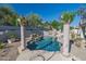 Backyard swimming pool featuring columns, a rock waterfall and desert landscaping at 11446 E Sweetwater Ave, Scottsdale, AZ 85259