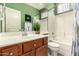 Bathroom offers green accent wall, chrome fixtures, and shower-tub combo at 12355 W Lincoln St, Avondale, AZ 85323