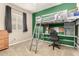 Bedroom features a lofted twin bed over deskspace and storage at 12355 W Lincoln St, Avondale, AZ 85323