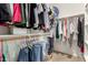 Walk-in closet features wood rod and shelving for optimal storage space at 12355 W Lincoln St, Avondale, AZ 85323