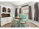 Charming dining room with vintage-style chairs, a round table, and lovely natural light at 12355 W Lincoln St, Avondale, AZ 85323