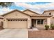 Inviting single-story home featuring a two-car garage and well-kept landscaping at 12355 W Lincoln St, Avondale, AZ 85323