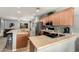 Kitchen with modern appliances, a breakfast bar, and an open layout leading to living areas at 12355 W Lincoln St, Avondale, AZ 85323