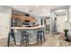 Kitchen with stainless steel appliances, breakfast bar, and a view into the adjacent dining area at 12355 W Lincoln St, Avondale, AZ 85323