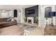 Living room featuring a modern fireplace, TV, and elegant furnishings for a comfortable living space at 12355 W Lincoln St, Avondale, AZ 85323