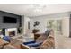Open living space with modern fireplace and sliding glass doors leading to a backyard patio at 12355 W Lincoln St, Avondale, AZ 85323