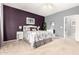 Comfortable bedroom featuring neutral carpet, ceiling fan, and ensuite bathroom at 12355 W Lincoln St, Avondale, AZ 85323