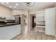 Well-appointed kitchen with stainless steel appliances, ample counter space, and white cabinetry at 13015 W Blue Sky Dr, Sun City West, AZ 85375