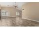 Bright living room showcasing tile flooring, plantation shutters, and recessed lighting at 13015 W Blue Sky Dr, Sun City West, AZ 85375