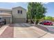 Charming two-story home featuring a three car garage, mature trees, and well maintained landscaping at 13540 N 87Th Dr, Peoria, AZ 85381