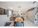 Open floor plan features a dining area, kitchen with bar seating, and built-in cabinets for a seamless living space at 14417 N 151St Dr, Surprise, AZ 85379