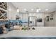 Bright kitchen featuring stainless steel appliances, stone countertops, and stylish pendant lighting above the island at 14417 N 151St Dr, Surprise, AZ 85379