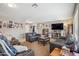 Spacious living room with cozy seating, neutral walls, and a view into other rooms, perfect for entertaining guests at 14417 N 151St Dr, Surprise, AZ 85379