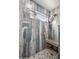 Shower features tile surround, seating area and window at 14417 N 151St Dr, Surprise, AZ 85379