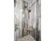 Shower featuring tile surround, seat and mounted shower head at 14417 N 151St Dr, Surprise, AZ 85379