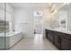 Serene bathroom featuring double vanities, a soaking tub, and a neutral color palette at 14551 N Adero Canyon Dr, Fountain Hills, AZ 85268