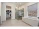 Luxurious bathroom featuring a glass-enclosed shower and a separate soaking tub at 14551 N Adero Canyon Dr, Fountain Hills, AZ 85268