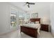 Comfortable bedroom with a wood frame bed, shutters, and neutral colors at 14551 N Adero Canyon Dr, Fountain Hills, AZ 85268