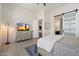 Comfortable bedroom with neutral tones, a sliding barn door, and a serene atmosphere at 14551 N Adero Canyon Dr, Fountain Hills, AZ 85268